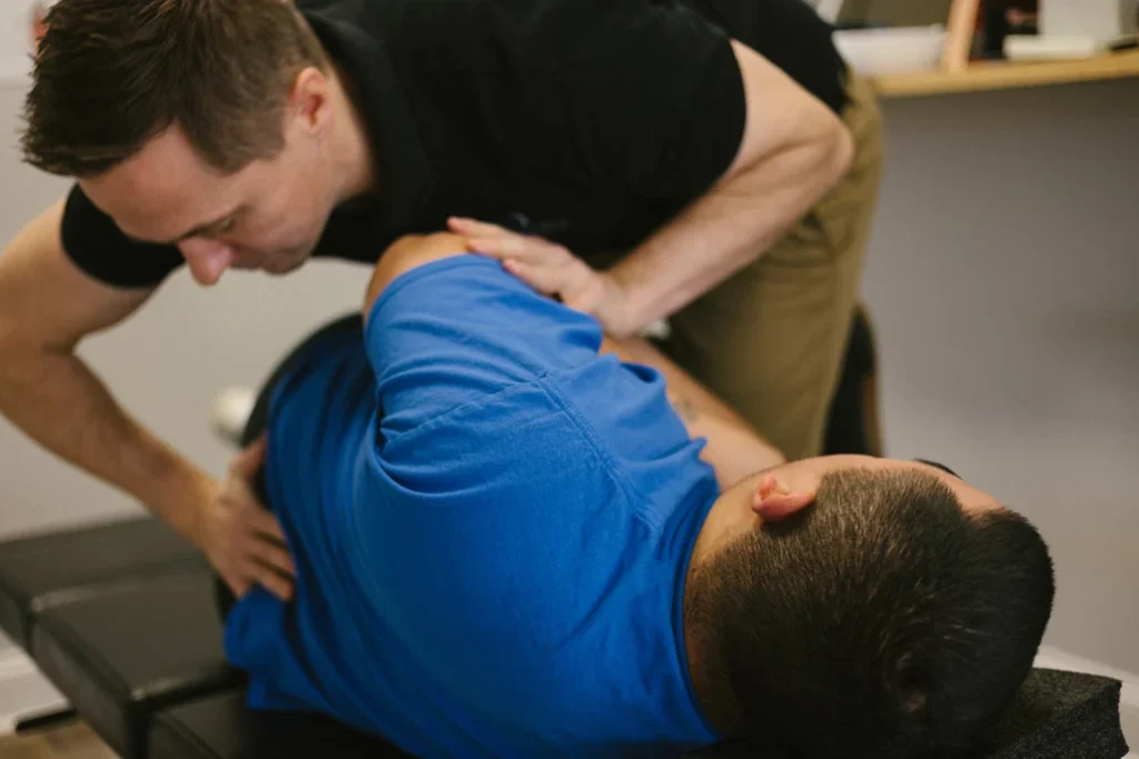 A chiropractor performing a chiropractic alignment on a patient with low back pain 1030x687 1